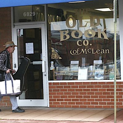 Daniel Lautenslager going into the Old Book Co.